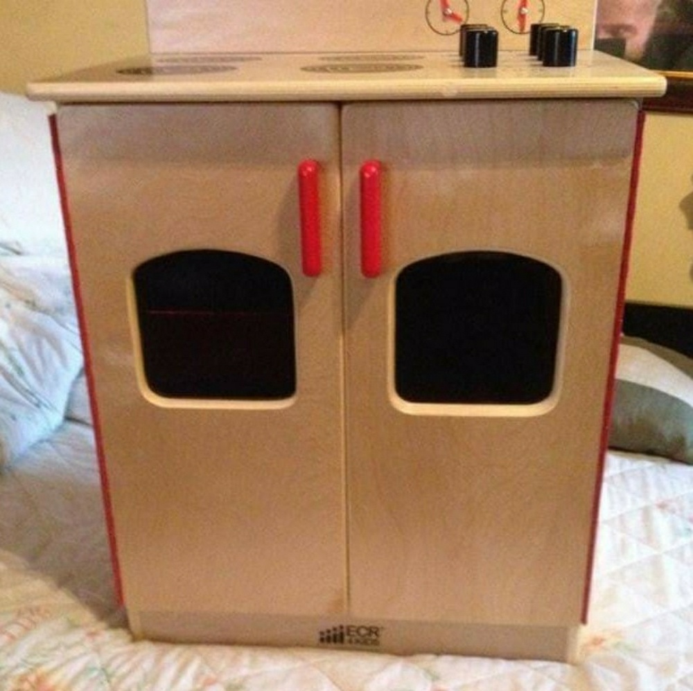 This is a kids boy/girl kitchen oven.
